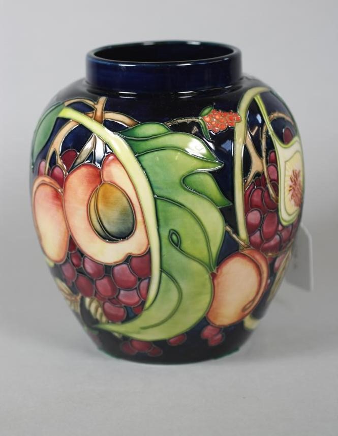 A MOORCROFT POTTERY JAR AND COVER Image