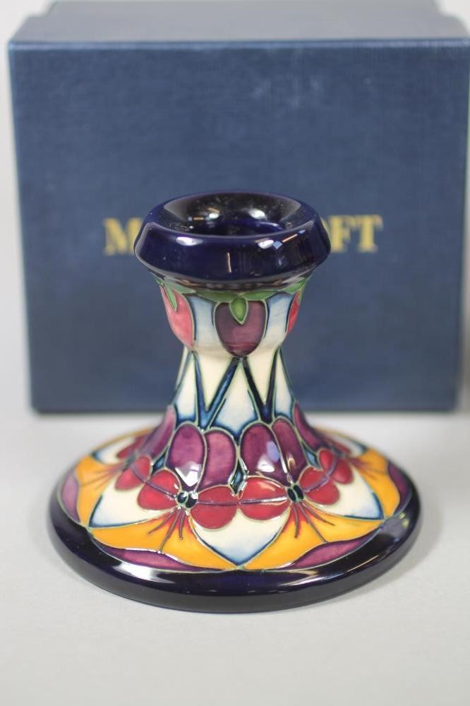 A PAIR OF MOORCROFT POTTERY DWARF CANDLESTICKS Image