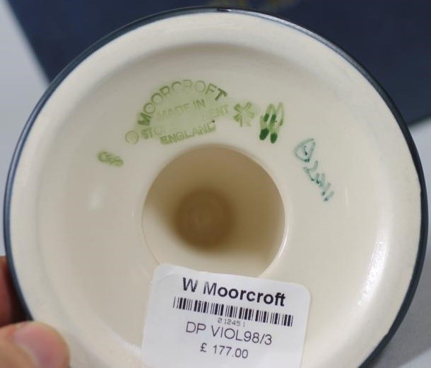 A PAIR OF MOORCROFT POTTERY DWARF CANDLESTICKS Image