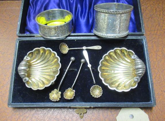 CASED SET OF SALTS AND TWO NAPKIN RINGS Image