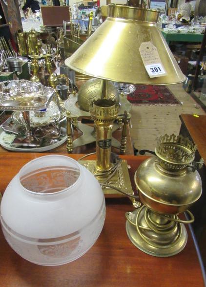 TWO BRASS LAMPS AND A GLASS LIGHT SHADE Image