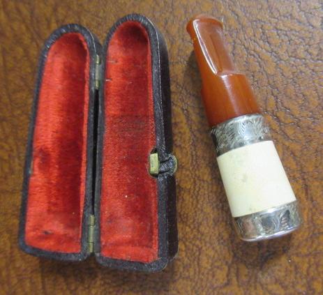 VICTORIAN SILVER AND AMBER CIGARETTE HOLDER AND CASE Image