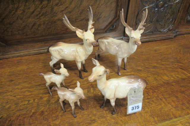 TWO BESWICK STAGS WITH BESWICK DOE AND FAWNS Image
