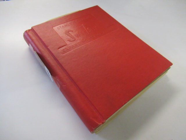 RED ALBUM OF STAMPS INCLUDING USA 1868 THREE DOLLAR STAMP Image