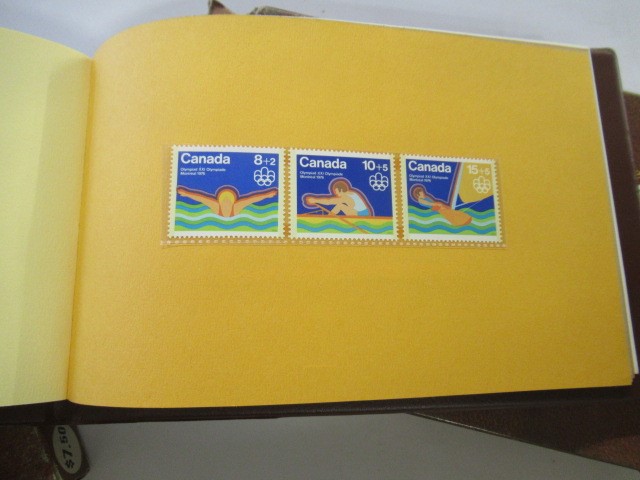 VOLUME 1 & 2 CANADIAN OLYMPIC STAMP ALBUMS Image