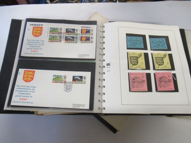 TWO ALBUMS OF CHANNEL ISLAND STAMPS AND FIRST DAY COVERS Image