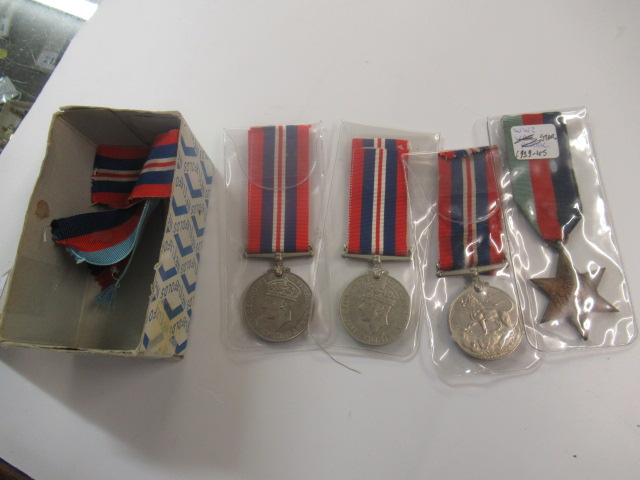 FOUR WWII MEDALS AND TWO 1939-45 STARS Image