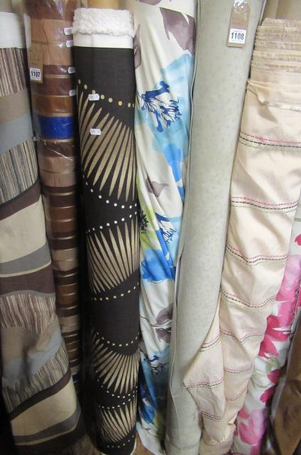 THREE ROLLS OF FABRIC Image