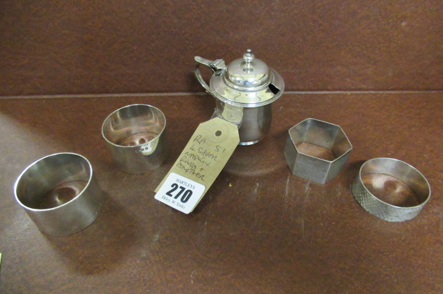 FOUR SILVER NAPKIN RINGS AND ANOTHER Image