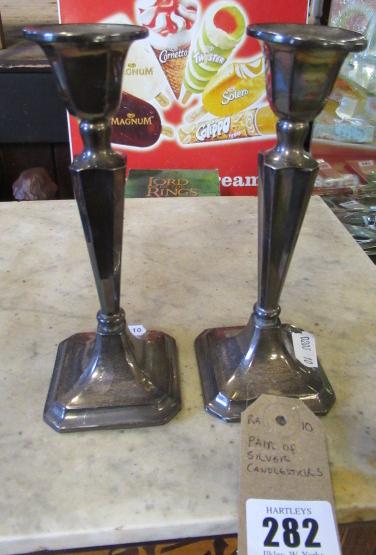PAIR OF SILVER CANDLESTICKS Image