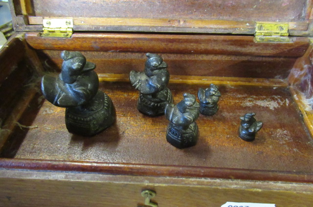 FIVE ANTIQUE GRADUATED CHINESE BRONZE OPIUM WEIGHTS AND BOX Image