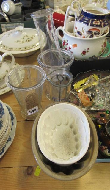 FOUR GLASS KITCHEN JARS AND TWO STONEWARE JELLY MOULDS Image