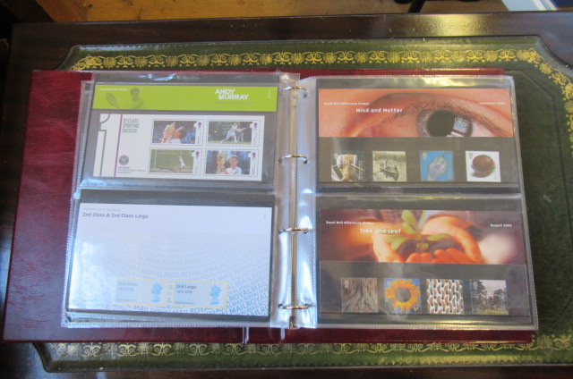 RED FOLDER OF MINT STAMPS AND PRESENTATION PACKS Image