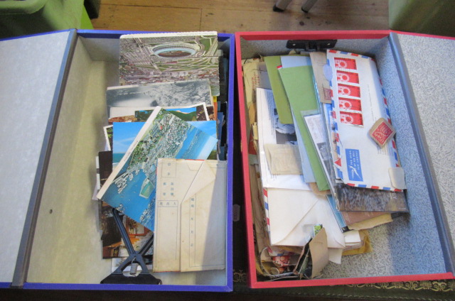 RED AND BLUE BINDERS OF STAMPS AND POSTCARDS Image