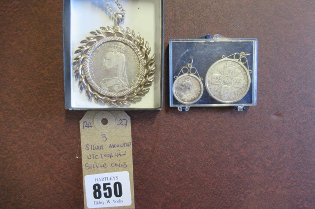 THREE  VICTORIAN SILVER COINS IN SILVER MOUNTS Image