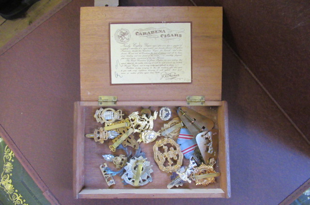 WOODEN CIGAR BOX OF MILITARY BADGES Image