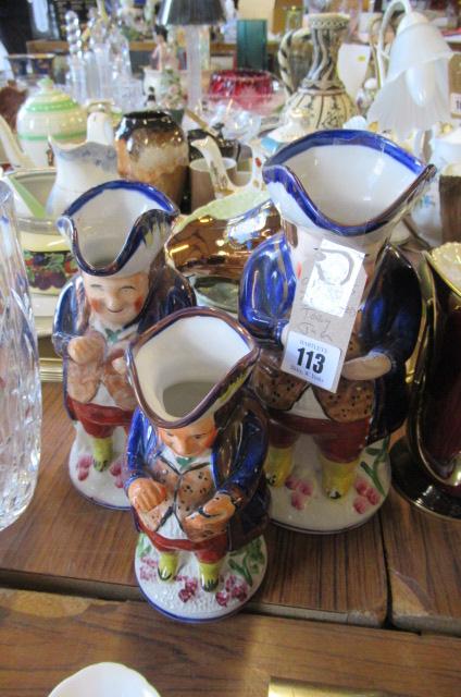 THREE GRADUATED TOBY JUGS Image