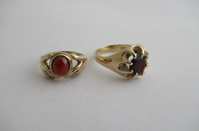 TWO 9CT GOLD AND GARNET RINGS Image