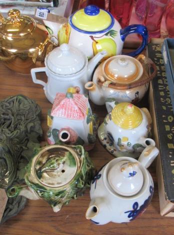 EIGHT TEAPOTS Image