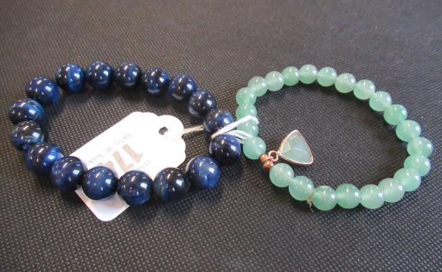 TWO POLISHED HARDSTONE BRACELETS Image