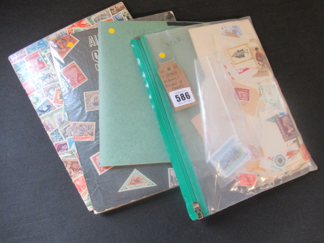 THREE STAMP ALBUMS AND A FOLDER OF STAMPS Image
