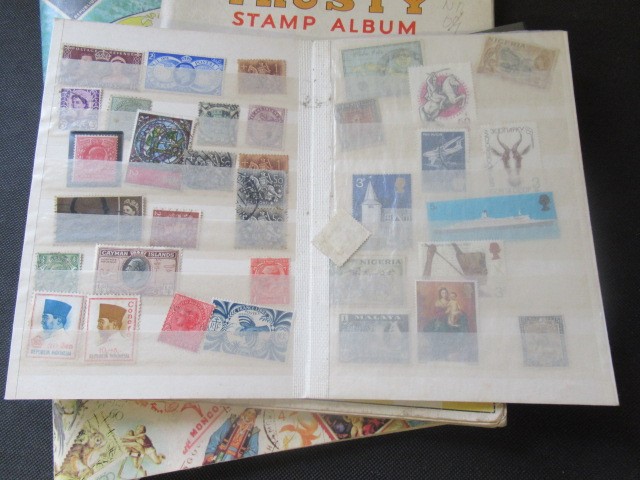 THREE ALBUMS OF MINT AND USED STAMPS Image