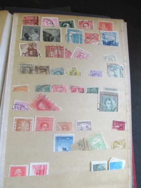 THREE ALBUMS OF MINT AND USED WORLD STAMPS Image