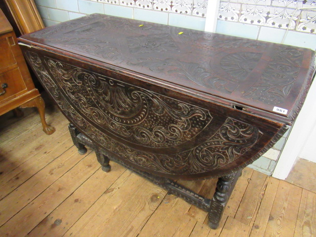 CARVED DARK OAK DROP LEAF TABLE Image