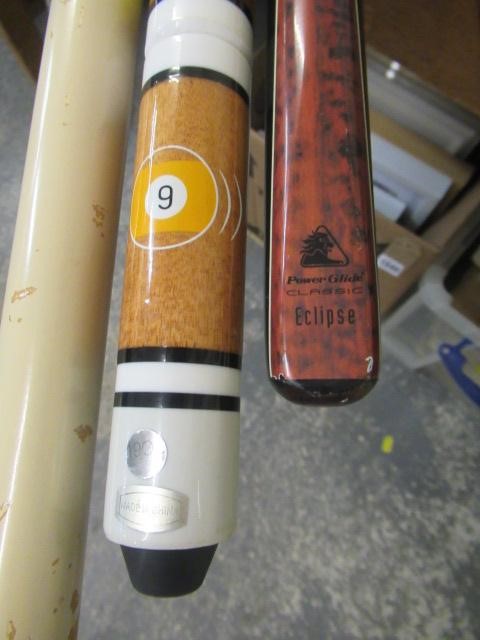 SEVEN SNOOKER CUES AND A SPIDER Image