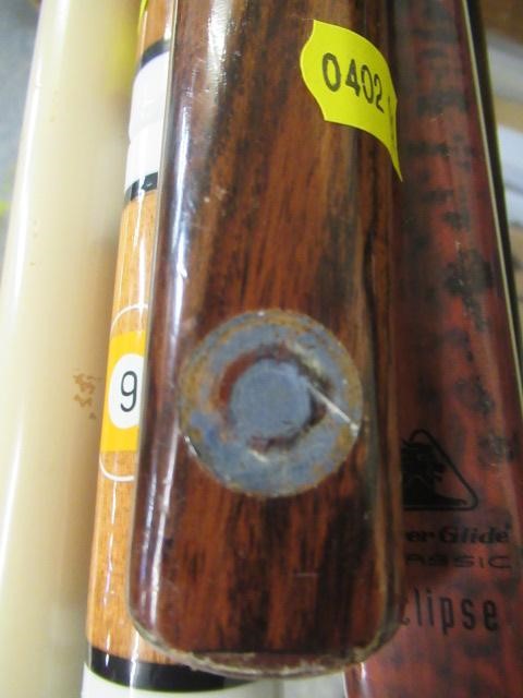 SEVEN SNOOKER CUES AND A SPIDER Image