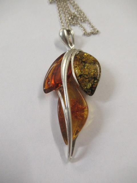 TRI-COLOUR AMBER PENDANT ON SILVER CHAIN Image