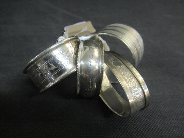 FOUR SILVER NAPKIN RINGS - 51.8G TOTAL Image