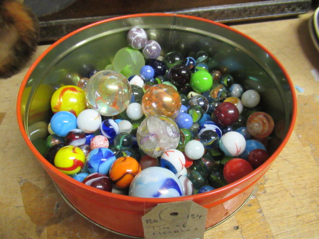 TIN OF MARBLES Image