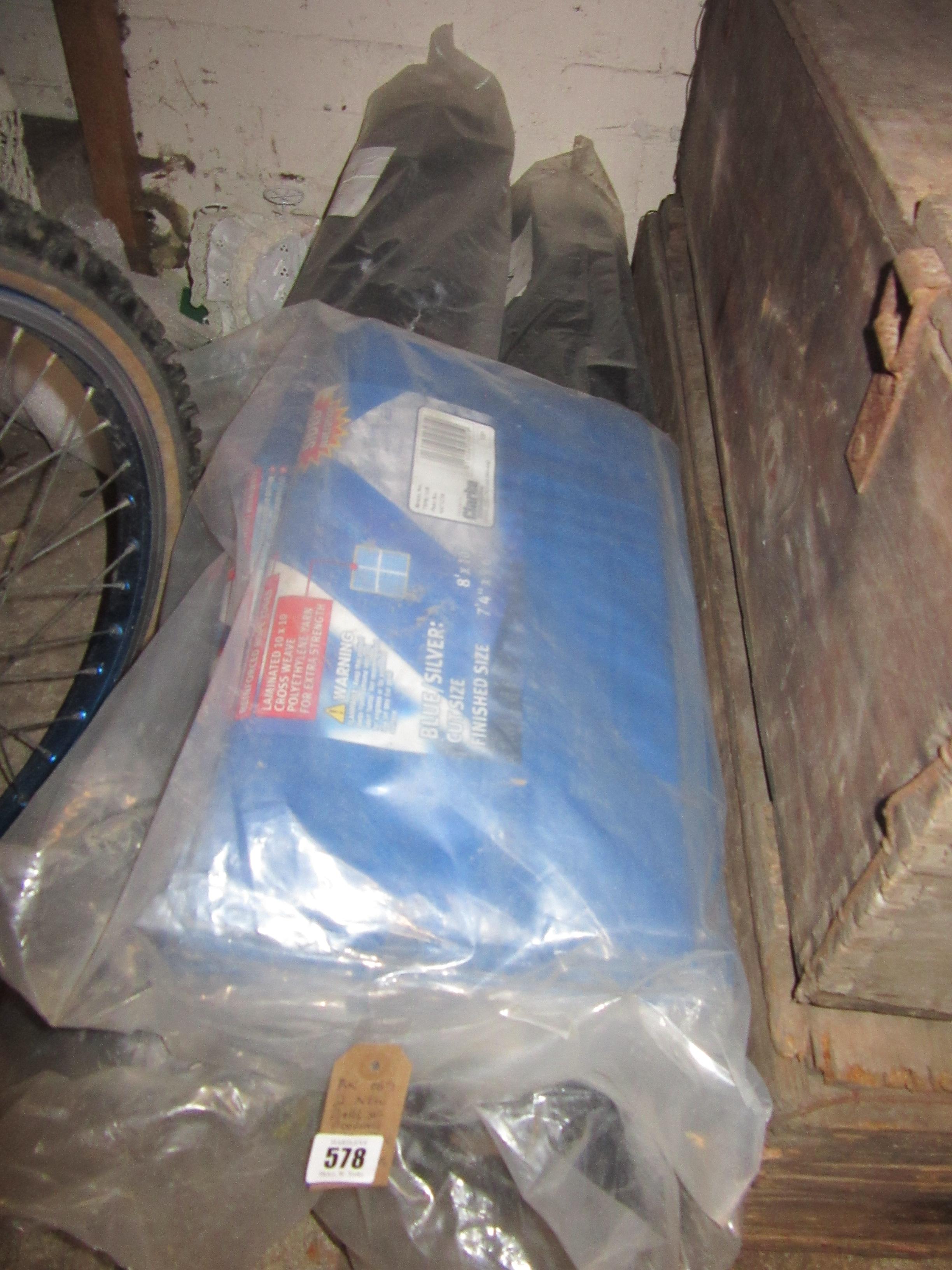 TWO NEW ROLLS OF ROOFING FELTS AND A BAG OF NEW TARPAULINS Image