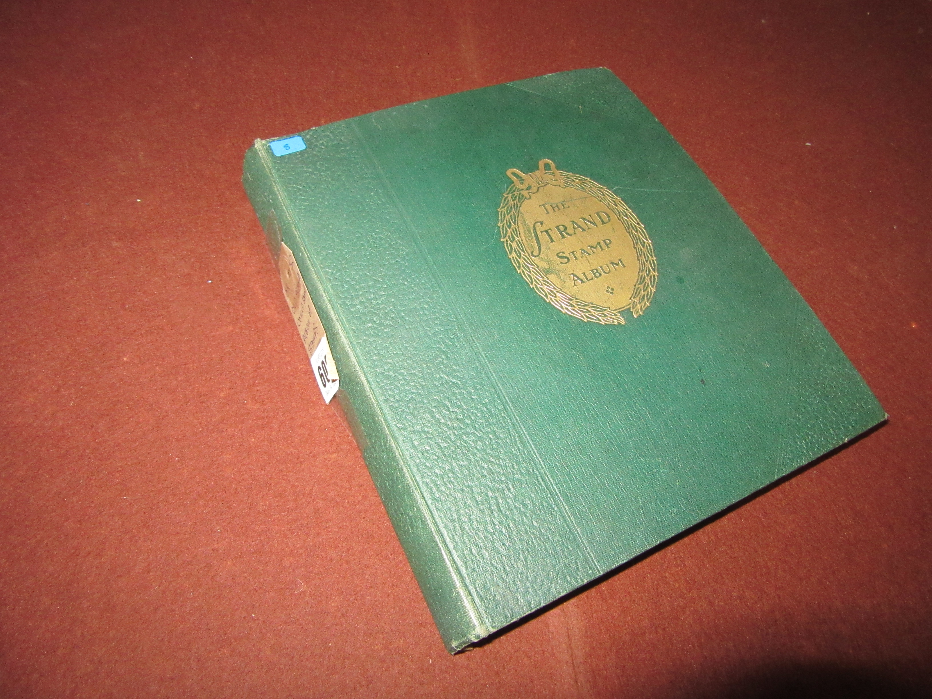 OLD STRAND WORLD STAMP ALBUM OF STAMPS Image