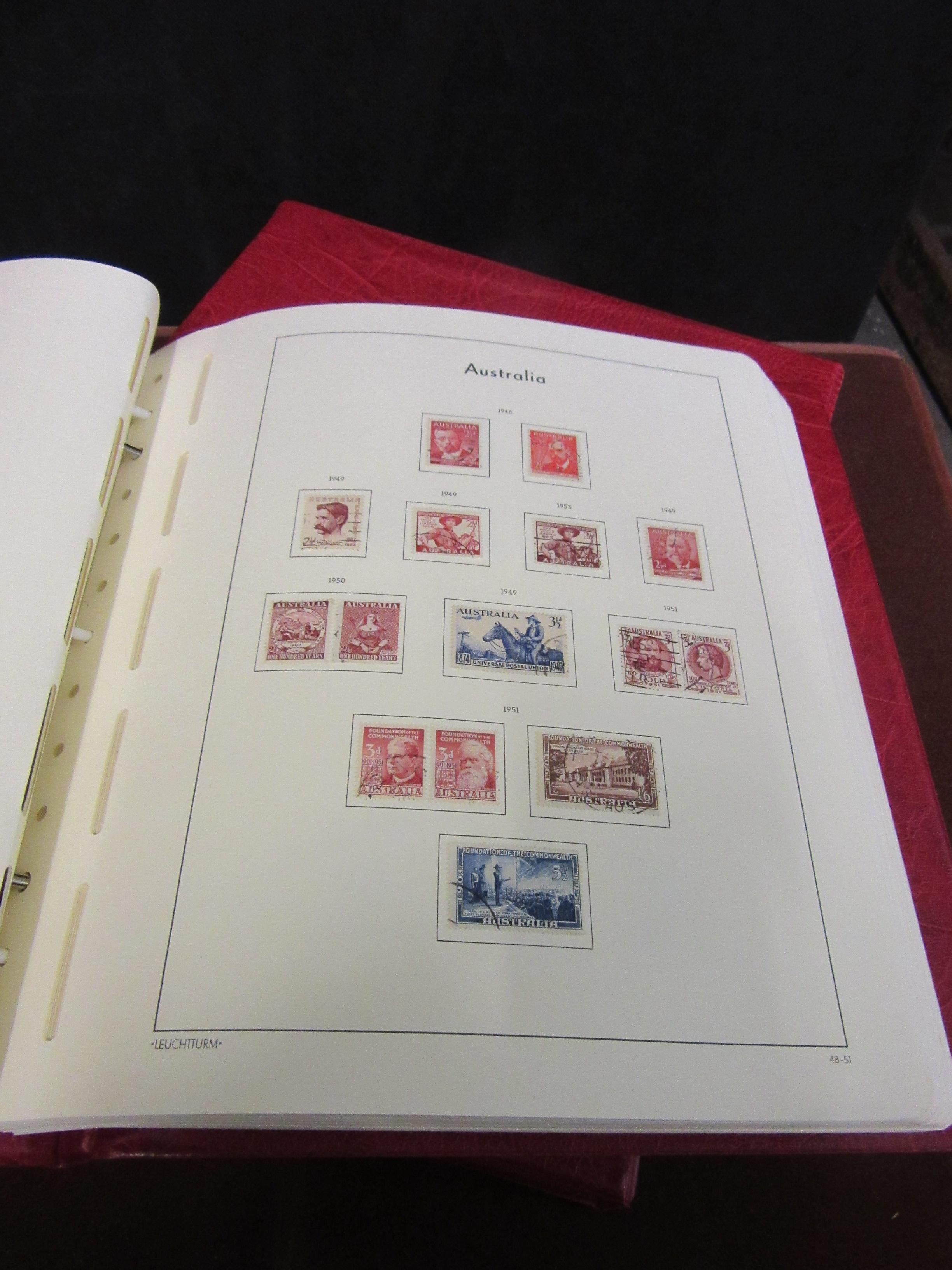 TWO RED BOUND AUSTRALIAN ALBUMS OF STAMPS Image