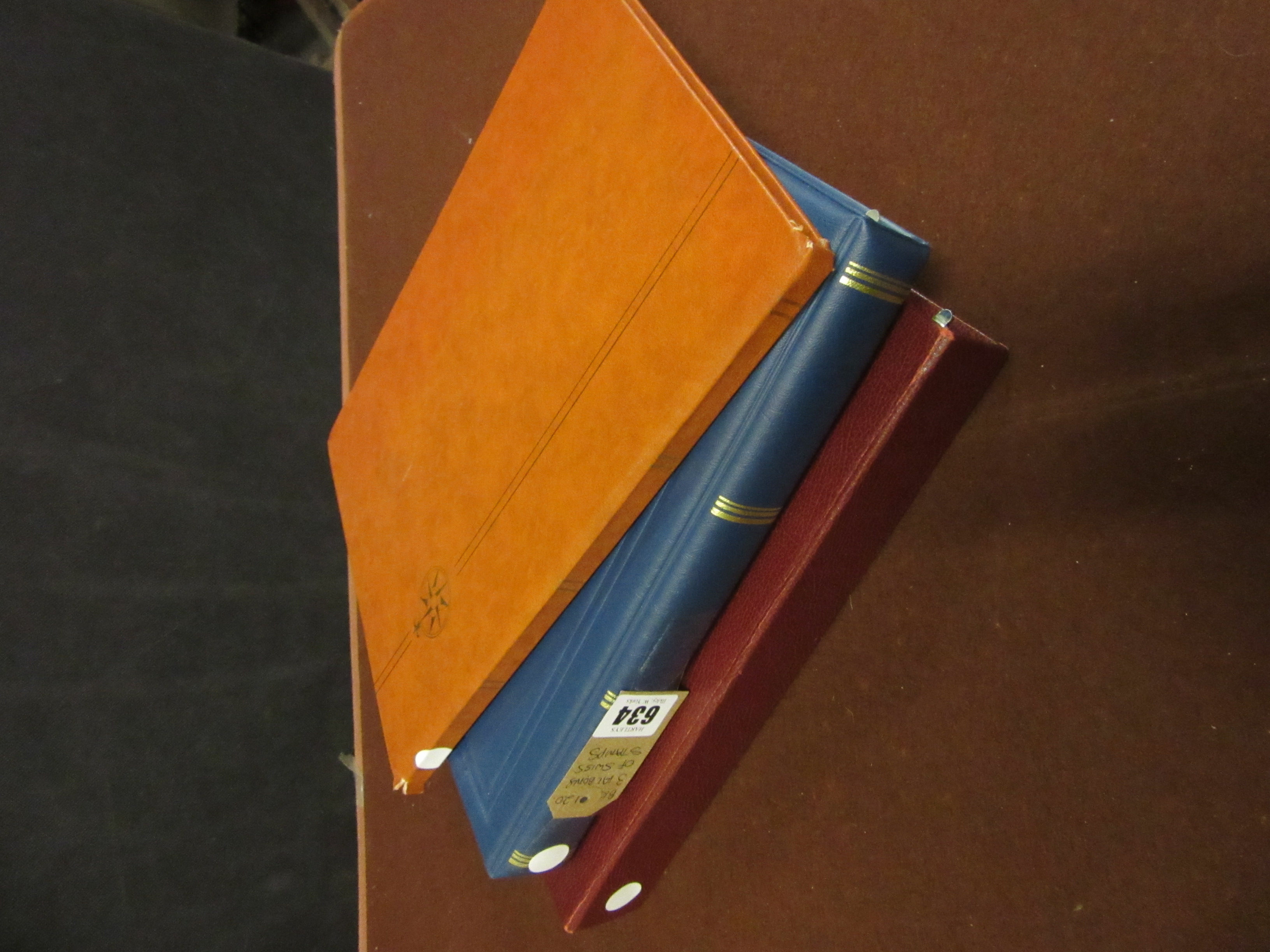 THREE ALBUMS OF SWISS STAMPS Image