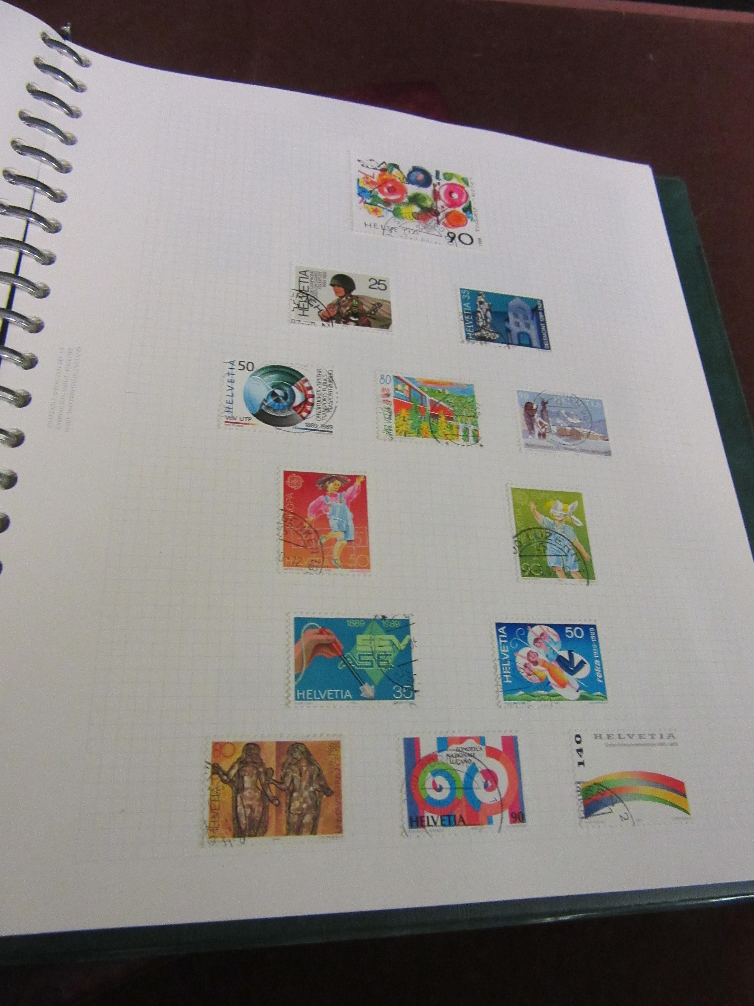 THREE ALBUMS OF SWISS STAMPS Image