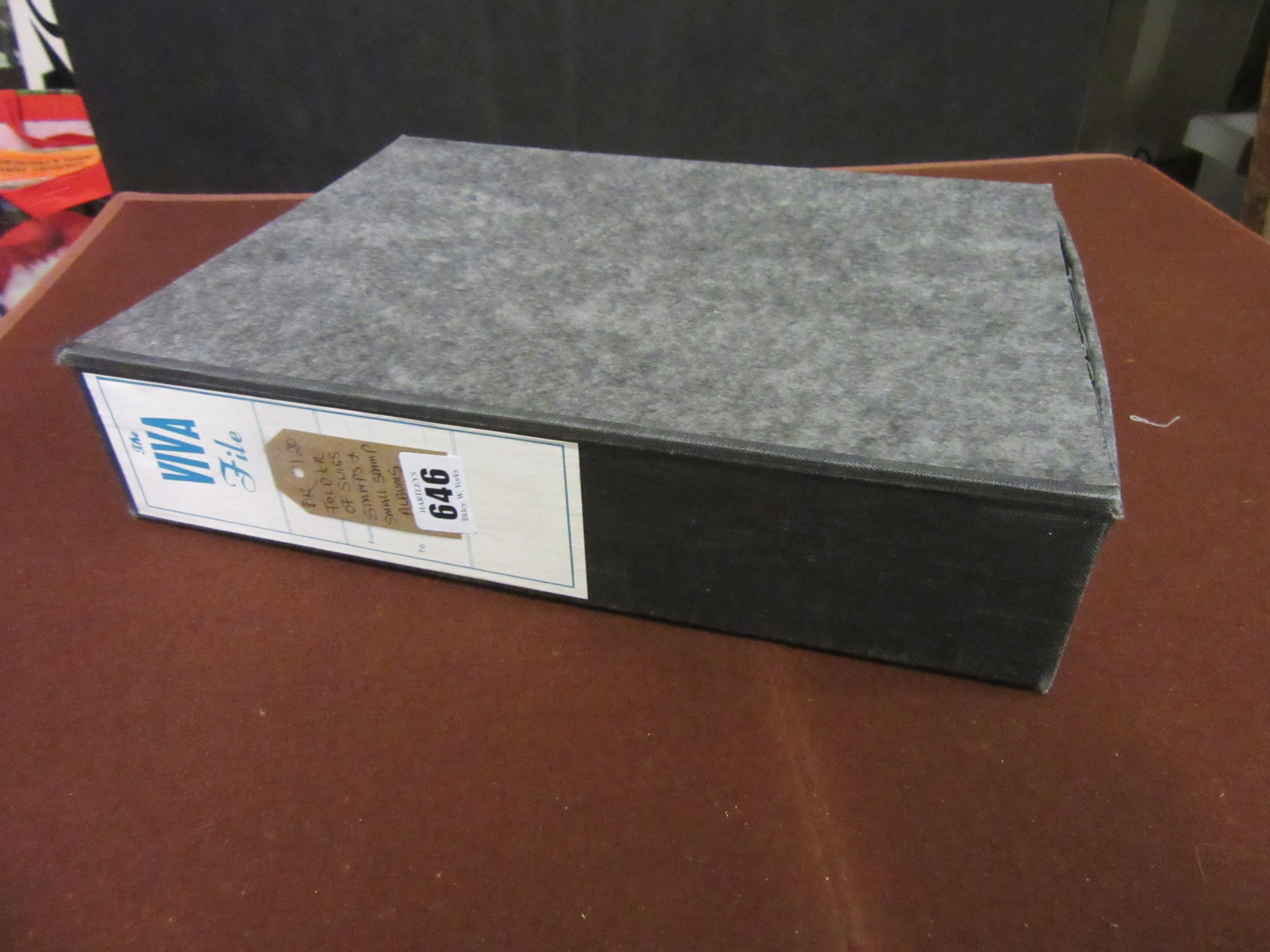 FOLDER OF SWISS STAMPS WITH SMALL STAMP ALBUMS Image