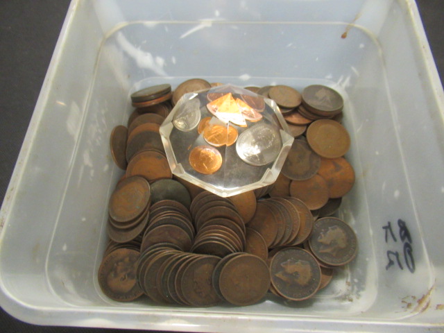 TUB OF UK PENNIES AND A PAPERWEIGHT Image