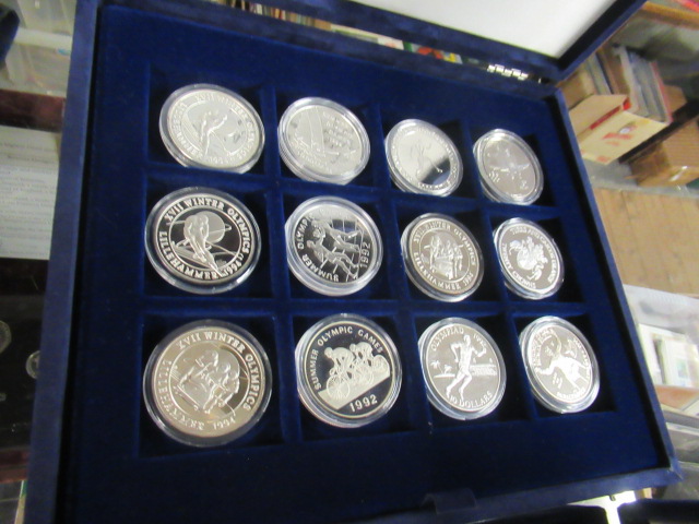 CASED OLYMPIC GAMES COIN COLLECTION - TWNETY THREE SILVER AND ONE BRONZE COIN Image