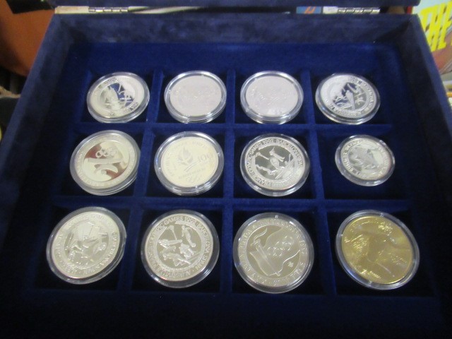 CASED OLYMPIC GAMES COIN COLLECTION - TWNETY THREE SILVER AND ONE BRONZE COIN Image