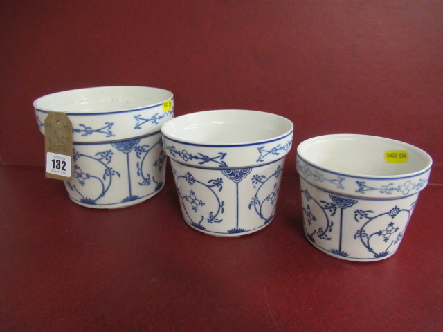 THREE GRADUATED BLUE AND WHITE PLANTERS Image