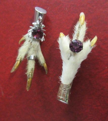 A SILVER MOUNTED GROUSE FOOT BROOCH AND ANOTHER Image