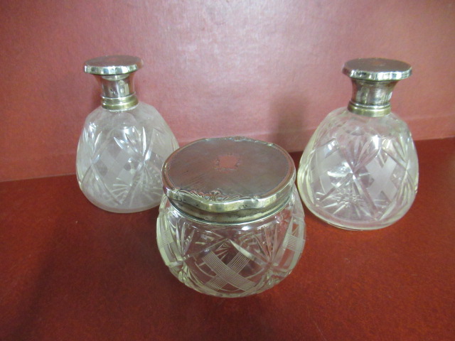 THREE WHITE METAL TOPPED BOTTLES Image