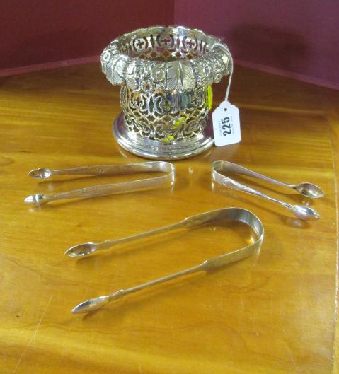 THREE PAIRS OF SILVER SUGAR TONGS AND AN EPNS SYPHON HOLDER Image