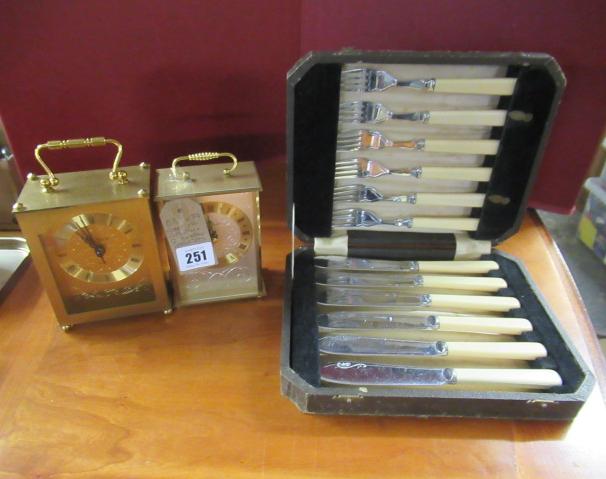 CASE OF CUTLERY AND TWO BATTERY OPERATED CARRIAGE CLOCKS Image