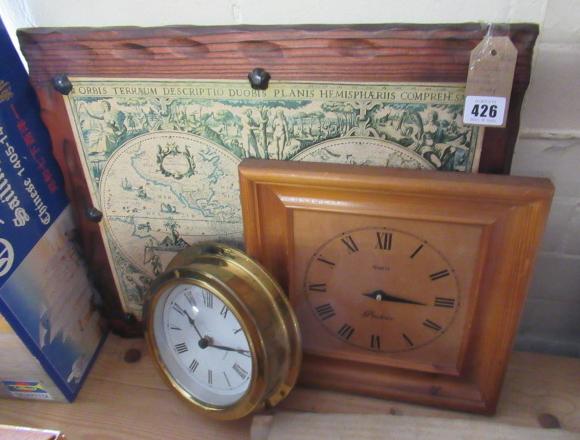 TWO CLOCKS AND A WOODEN MAP Image
