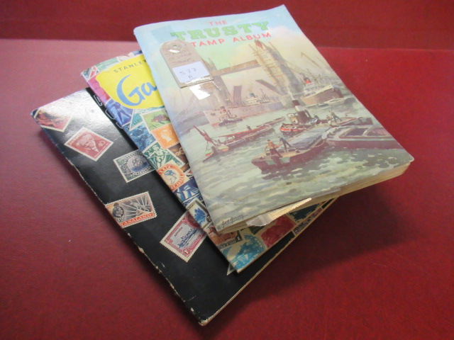 THREE ALBUMS OF WORLD STAMPS Image