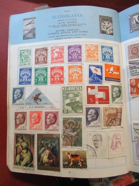 THREE ALBUMS OF WORLD STAMPS Image